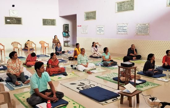 5 camp participants listening to Guruji